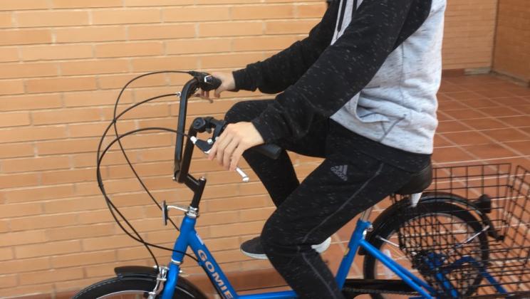 Student riding a bike. Bicicleta-Patinete-Patines project.
